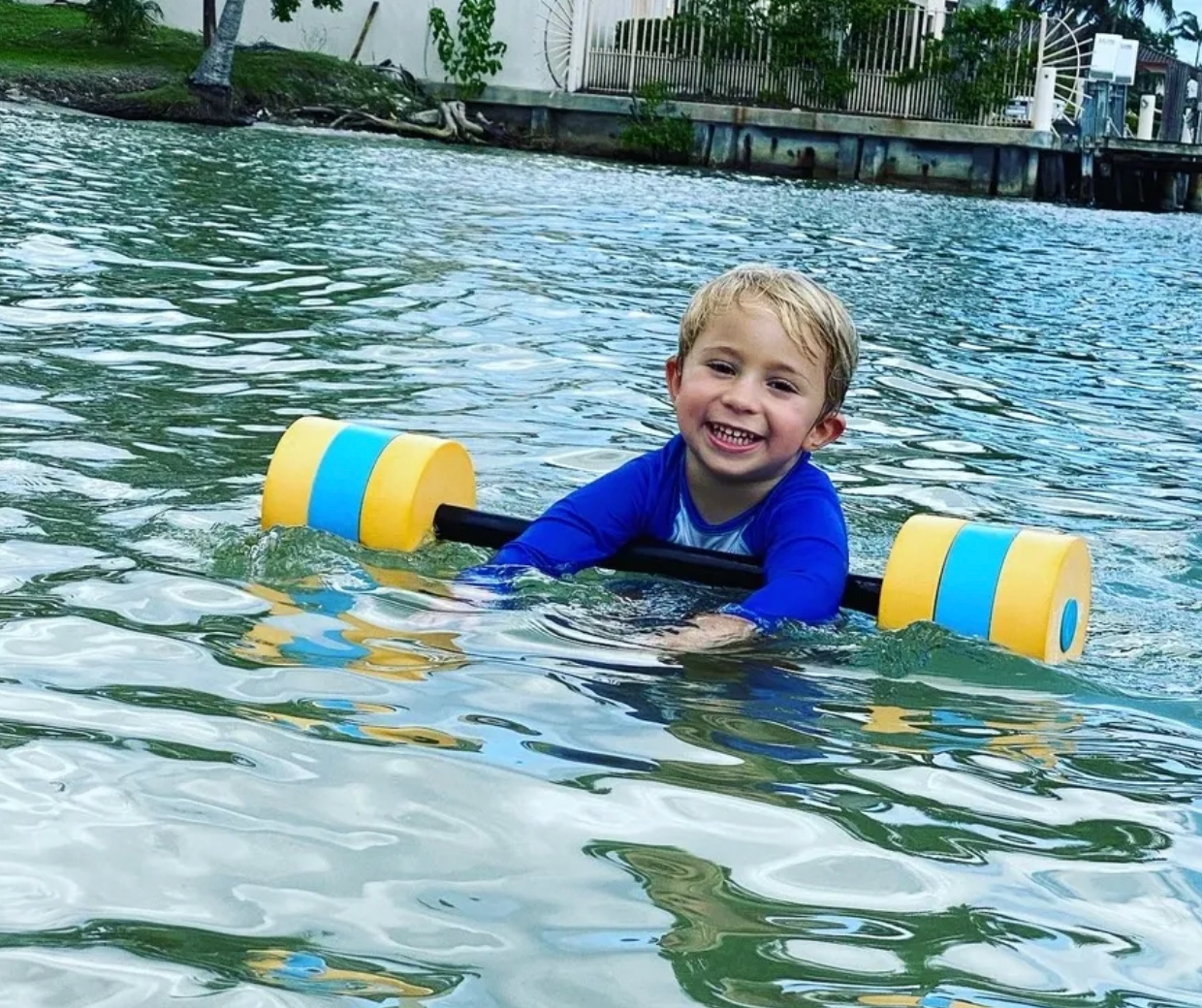 Greyson smiling at the pool